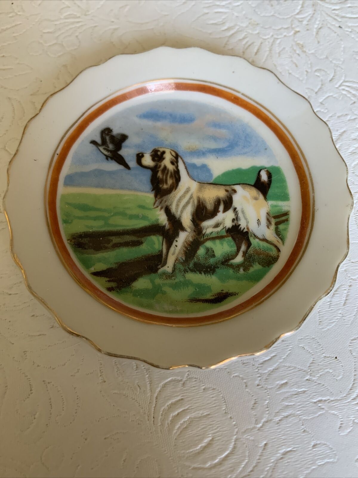 Small Plate with a Bird Dog Design - 3 3/4”