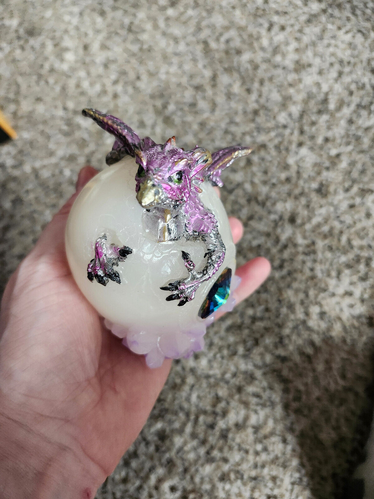 pink dragon coming out of egg