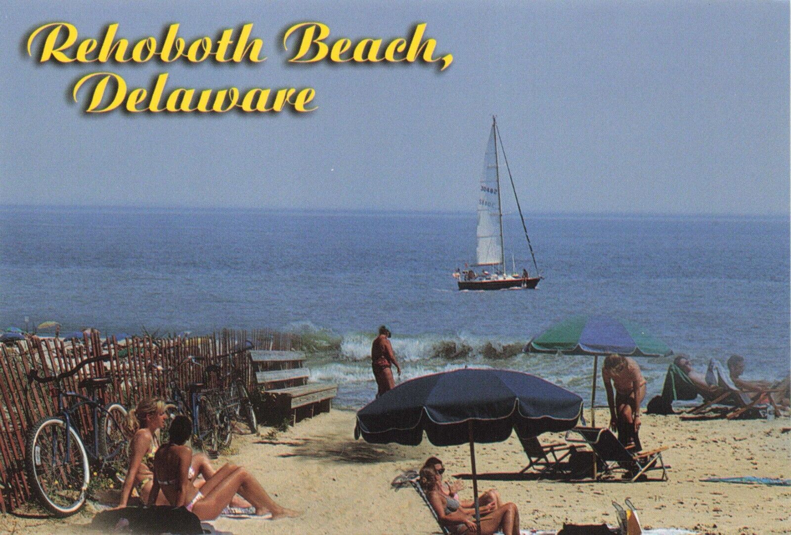 Postcard DE Rehoboth Beach Sail Boat Sun Bathers Waves Tan Sand Dunes Atlantic