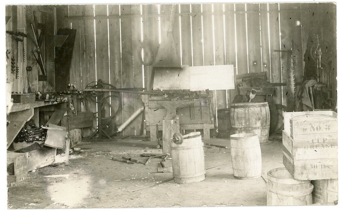 RPPC NY Adirondacks (Beach Photo) Interior Blacksmith or Wagon Shop