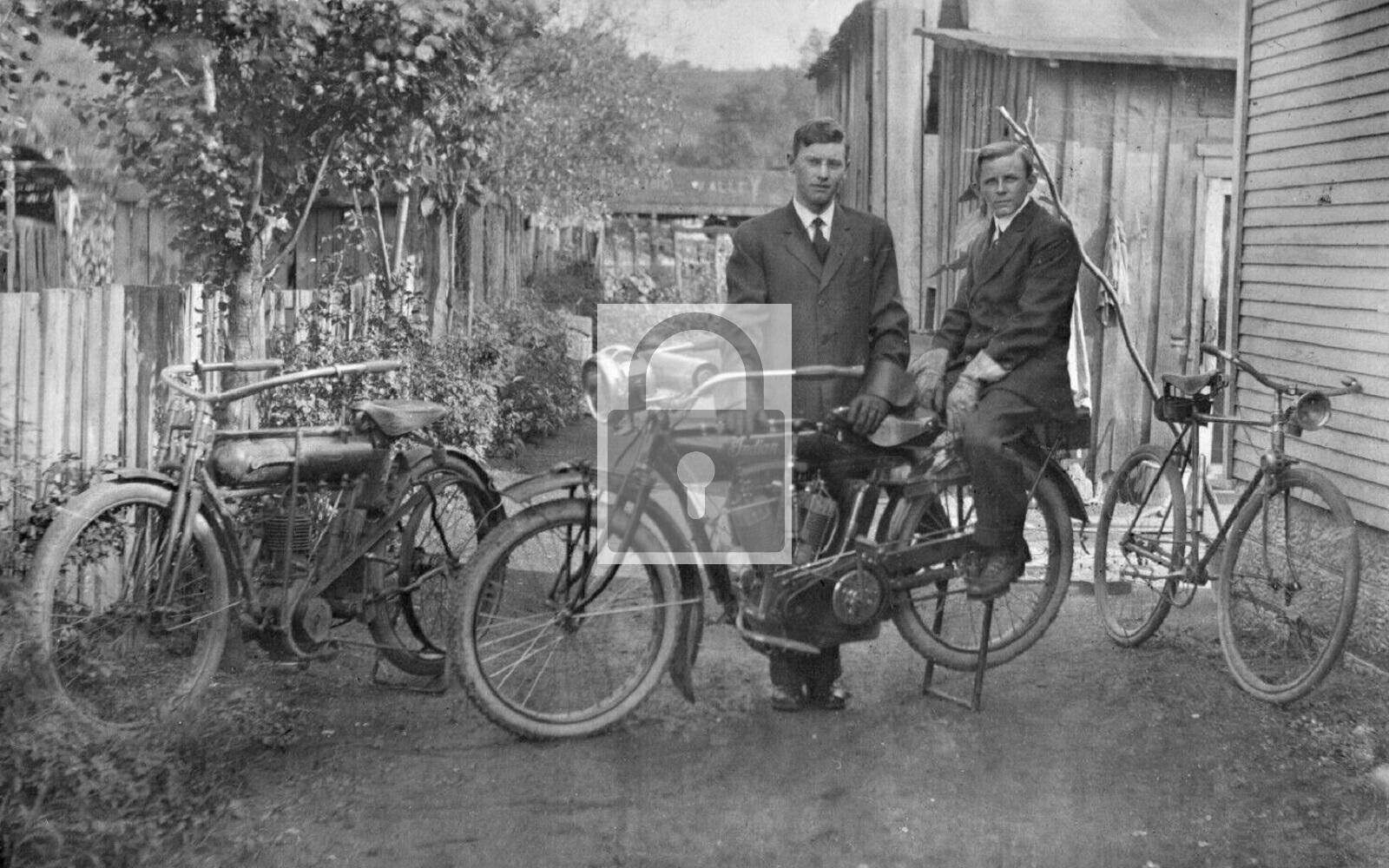 Two Boys Posing With Indian Motorcycles Buchtel Ohio OH Reprint Postcard