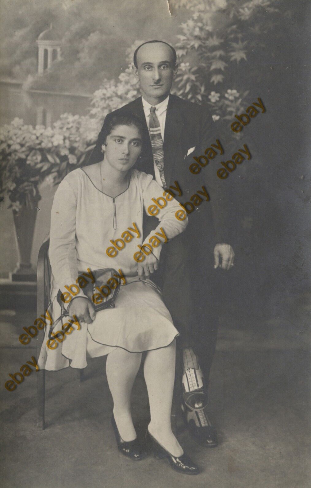 #49347 VOLOS Greece 1920s. Couple, background. Photo PC size RPPC TZEVAS.
