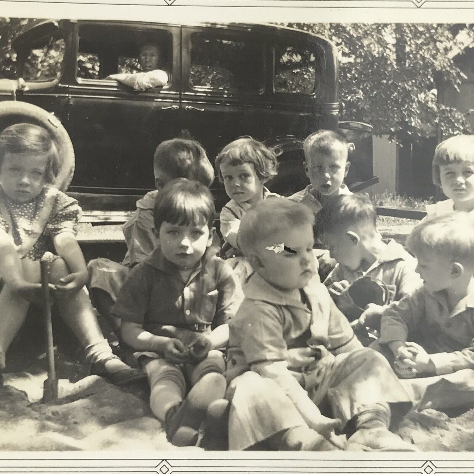 Vintage Black and White Photo Children Kids Sitting In Sandbox Park Outdoors