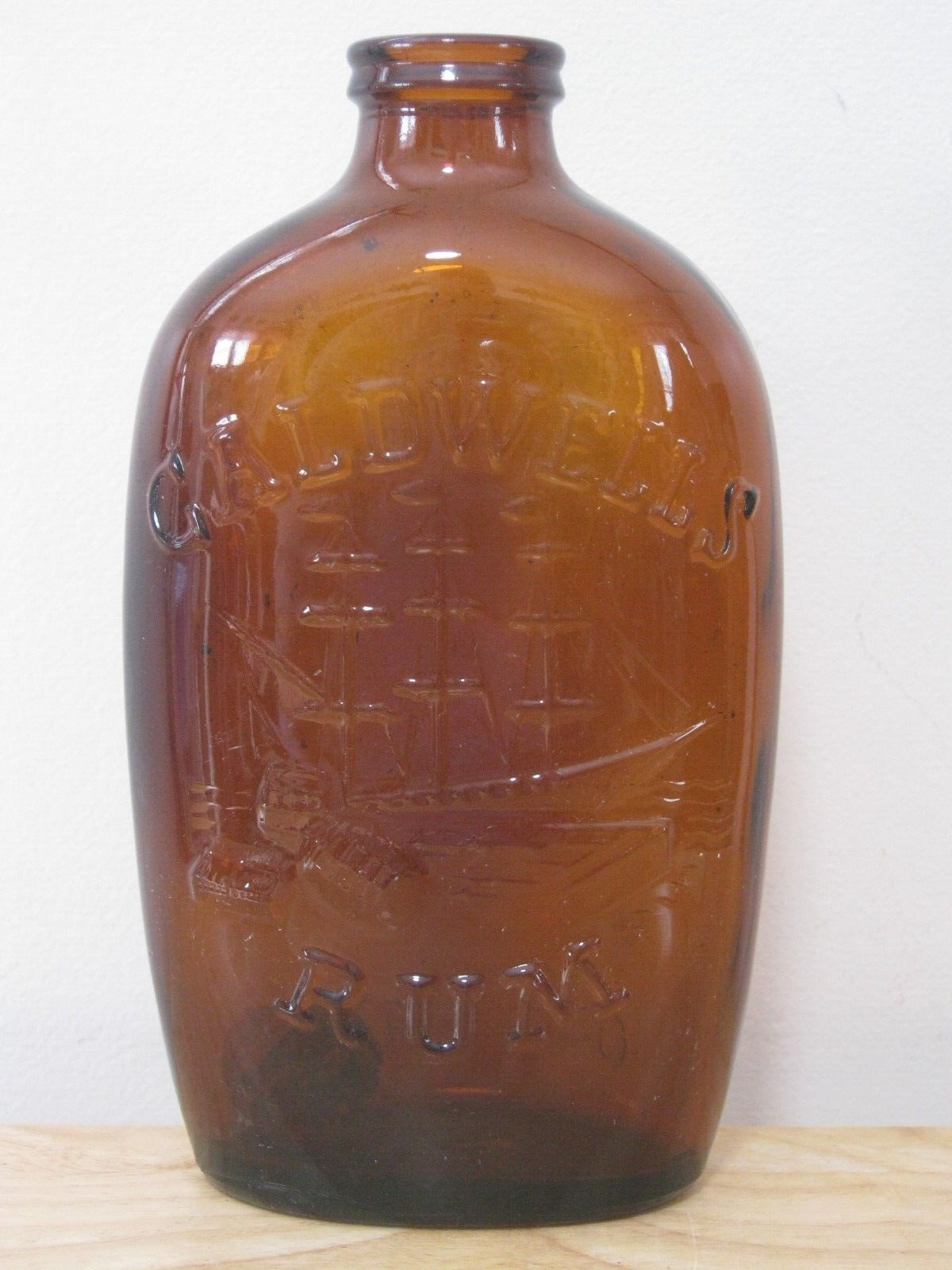 Vintage Amber Embossed Caldwell\'s Rum Bottle 1 Pint 3 Masted Schooner