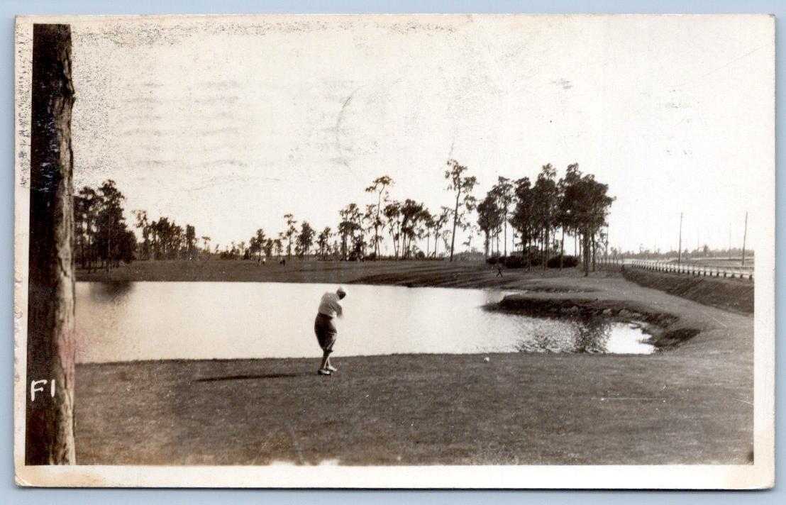 1931 RPPC GOLFER HITTING ACROSS WATER LAKE WALES LA POSTMARK PHOTO POSTCARD