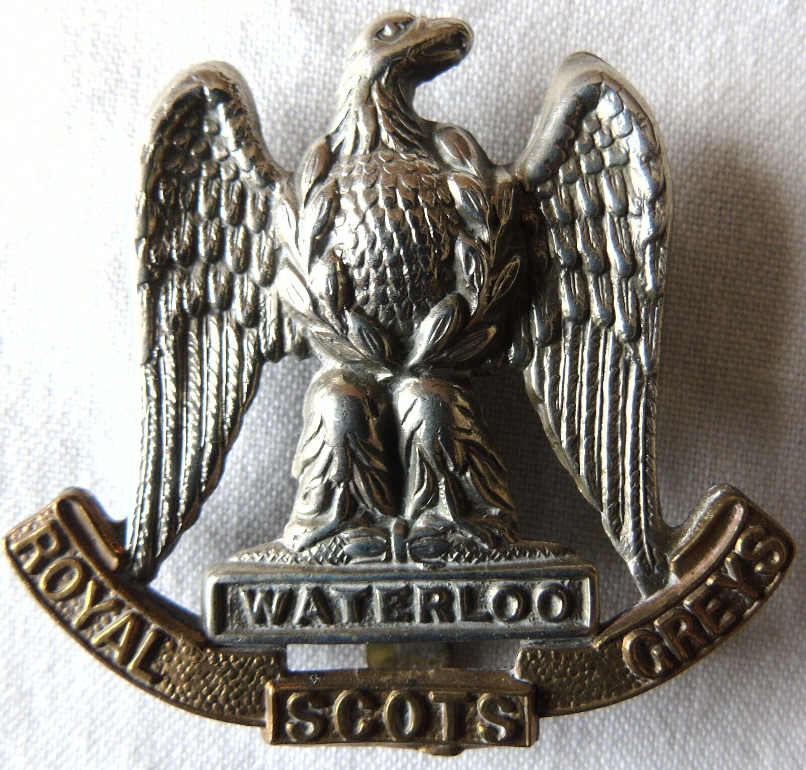 The Royal Scots Greys Regiment White Metal & Brass Cap Badge