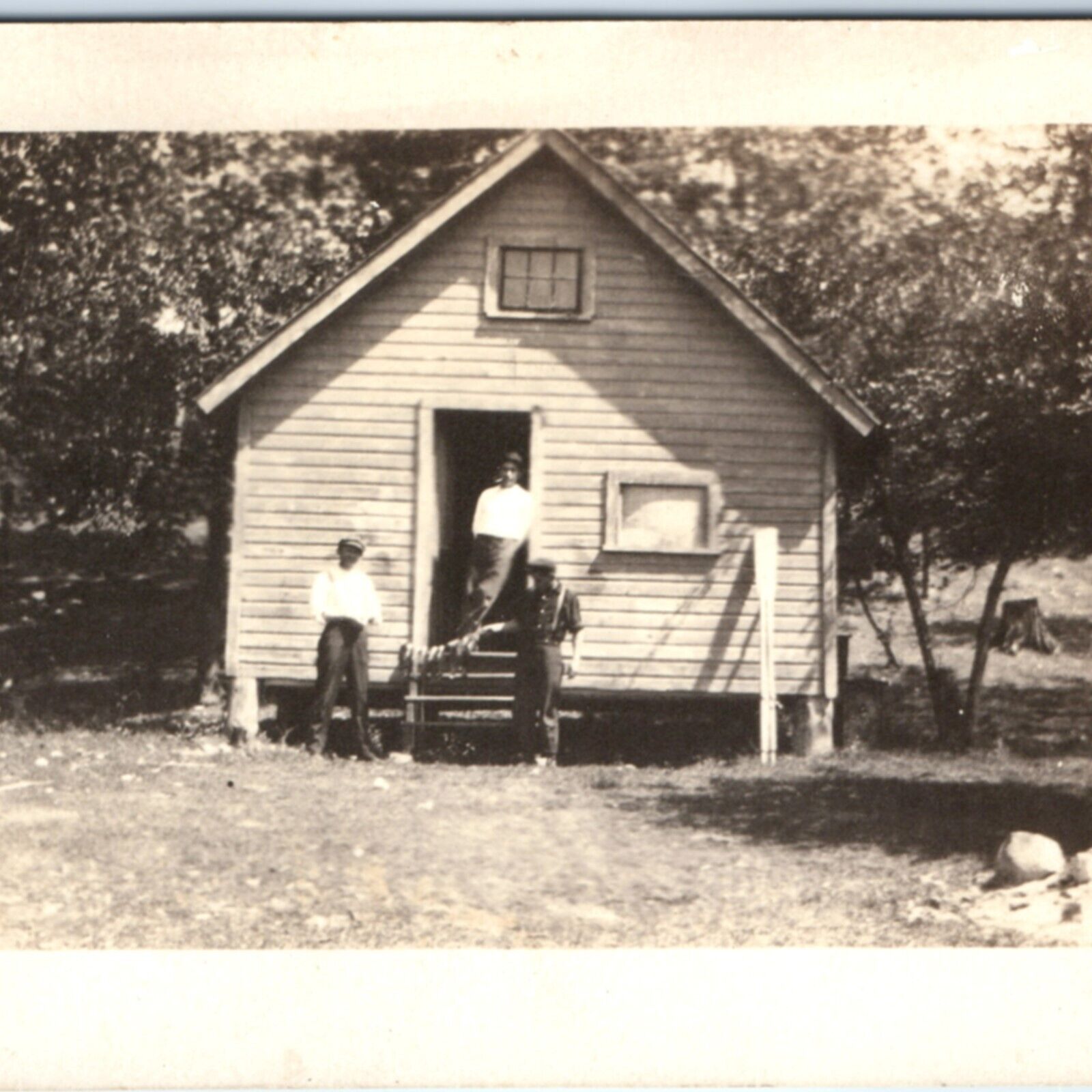 c1920s Handsome Young Men w/ Fishing Catch RPPC Cabin Shack Camp Real Photo A134