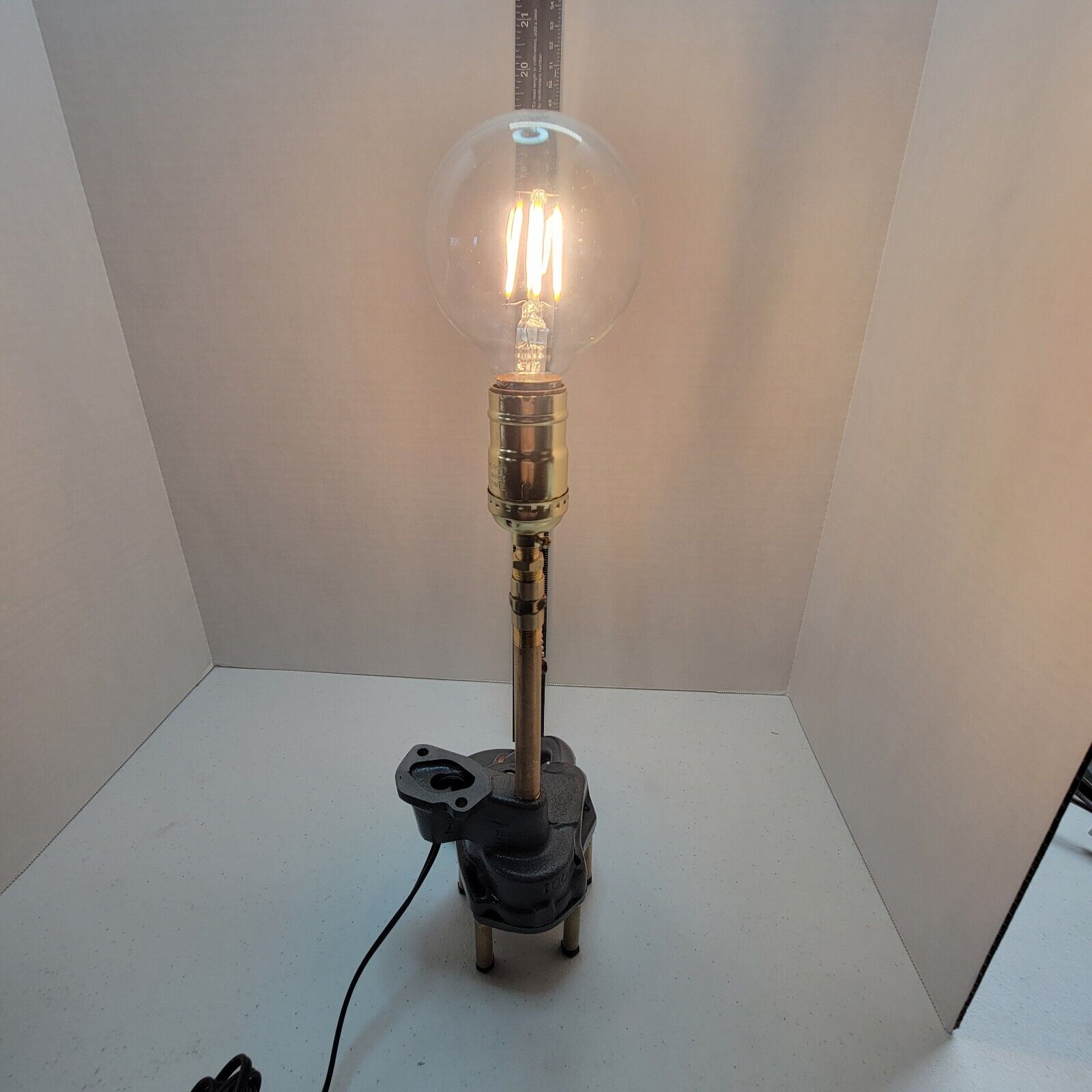 REPURPOSED LAMP made from a GM oil pump and pickup with a Cool Bulb.