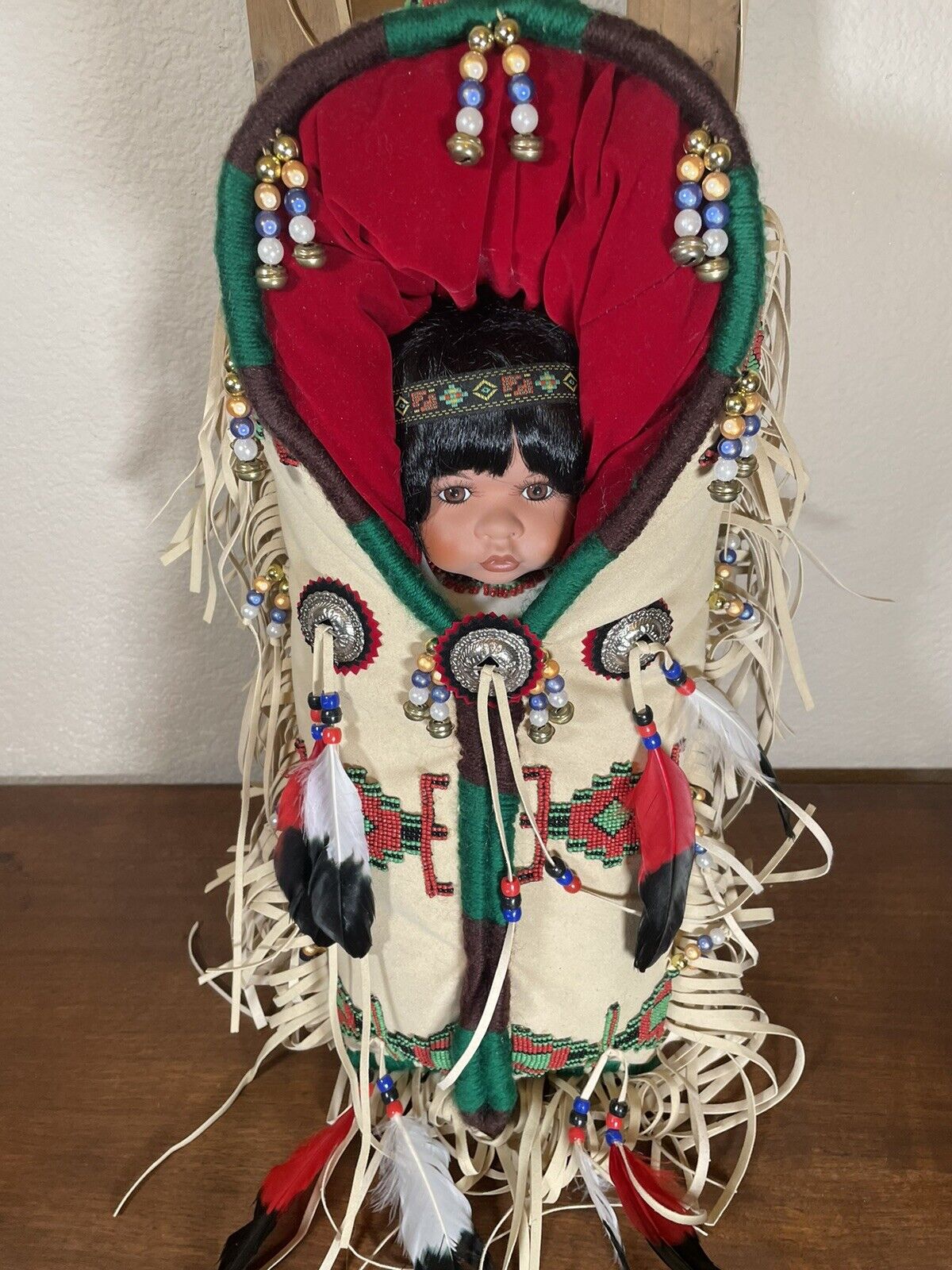 Native American Plains Indian Porcelain Doll on Beaded & Feathered Cradle Board