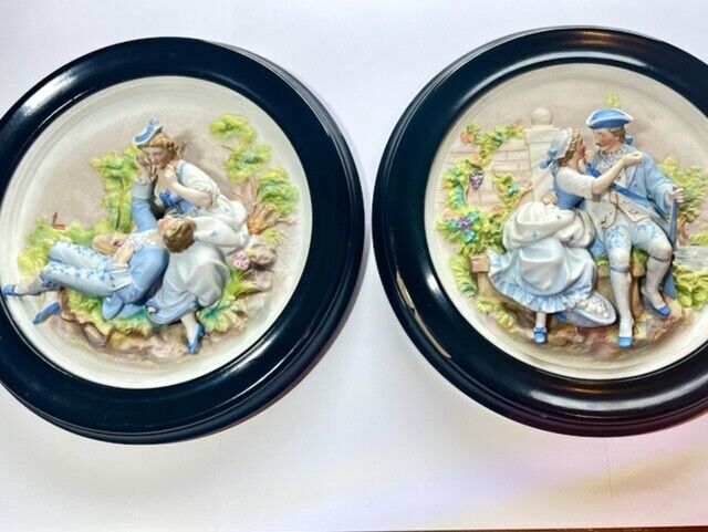 Vintage pair of Japan-bisque figurine wall plaques
