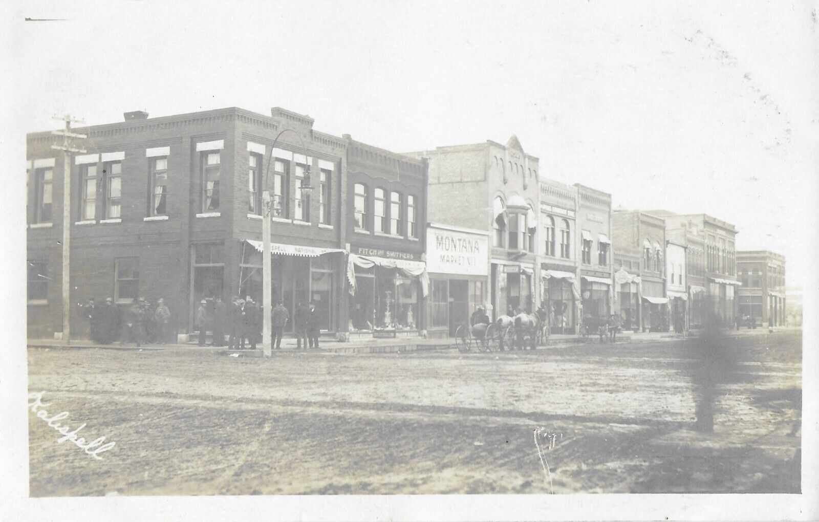 Kalispell MT 1909 RPPC postcard view down US 93 S from 3rd St.