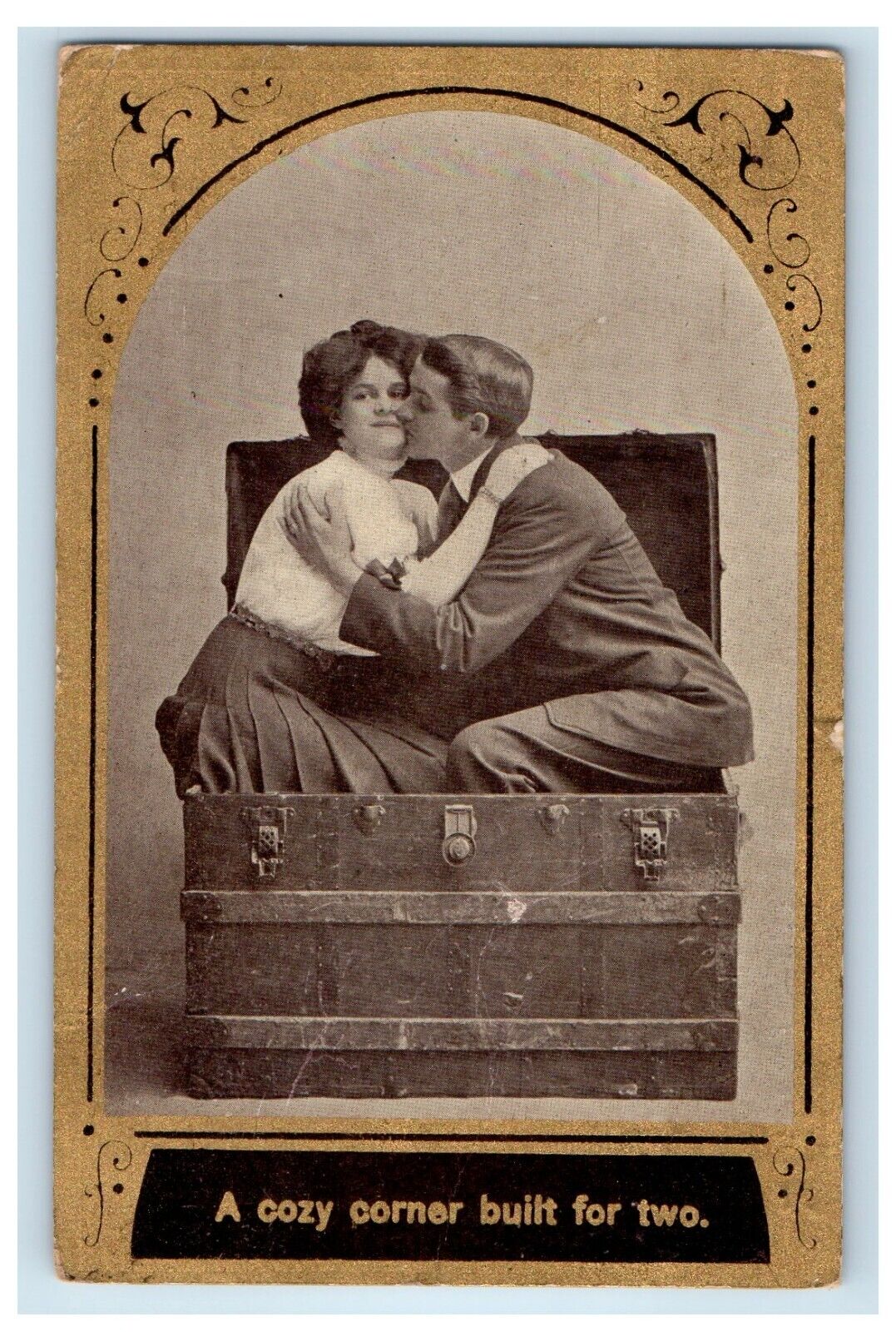 1909 A Sweet Couple In Chest Box Kissing Clarks Nebraska NE Antique Postcard