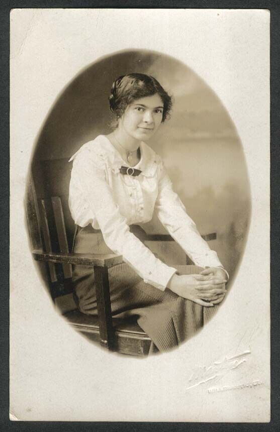 Smiling seated woman wearing locket RPPC Martin Willimantic CT