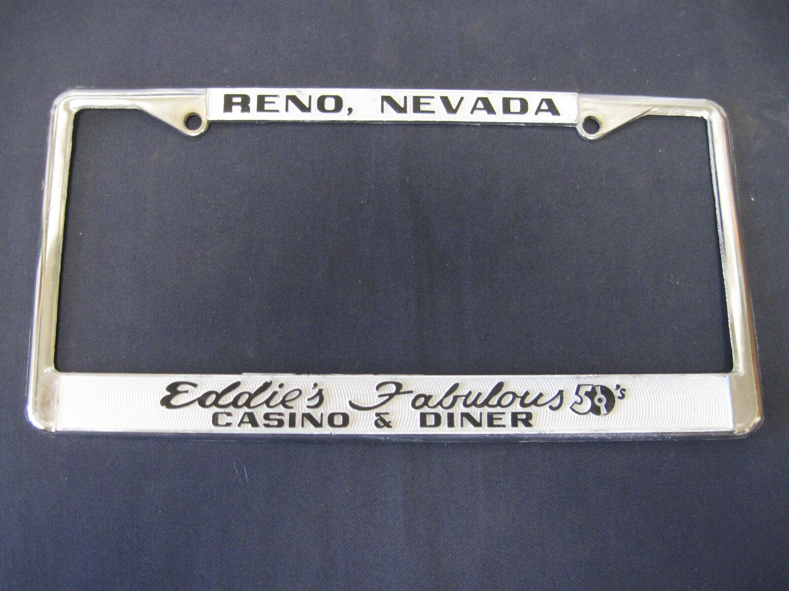 NOS  EDDIE\'S FAB 50\'S CASINO RENO NV. embossed metal frame license plate tag 