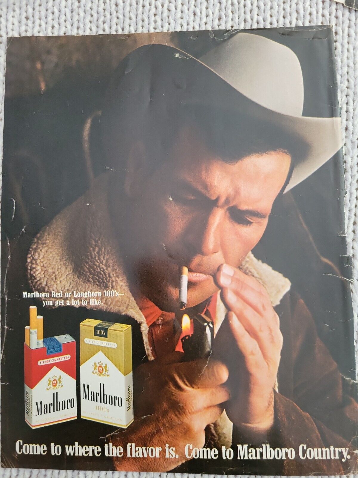 1968 Marlboro cowboy hat smoking cigarette lighter come to country vintage ad