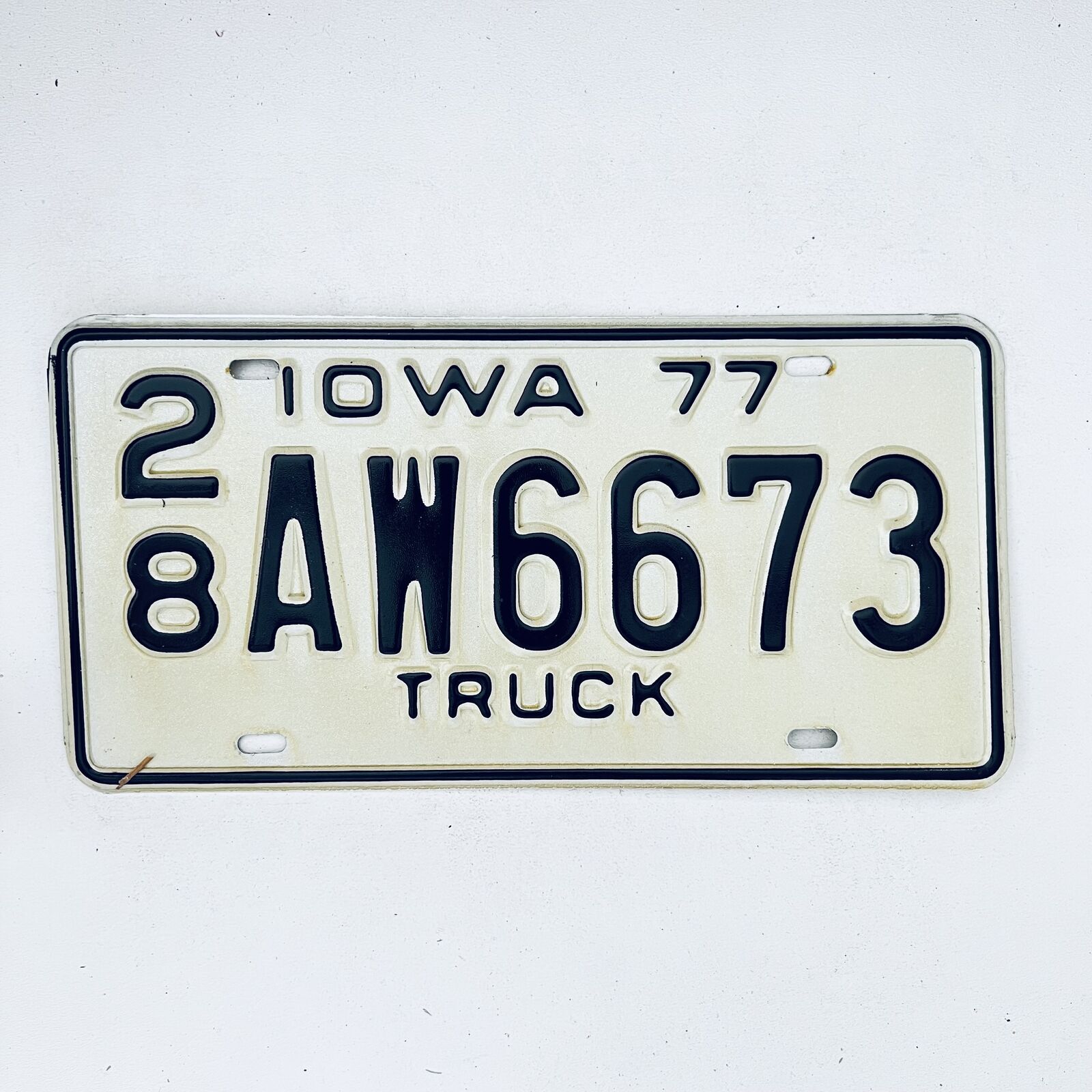 1977 United States Iowa Delaware County Passenger License Plate 28 AW6673
