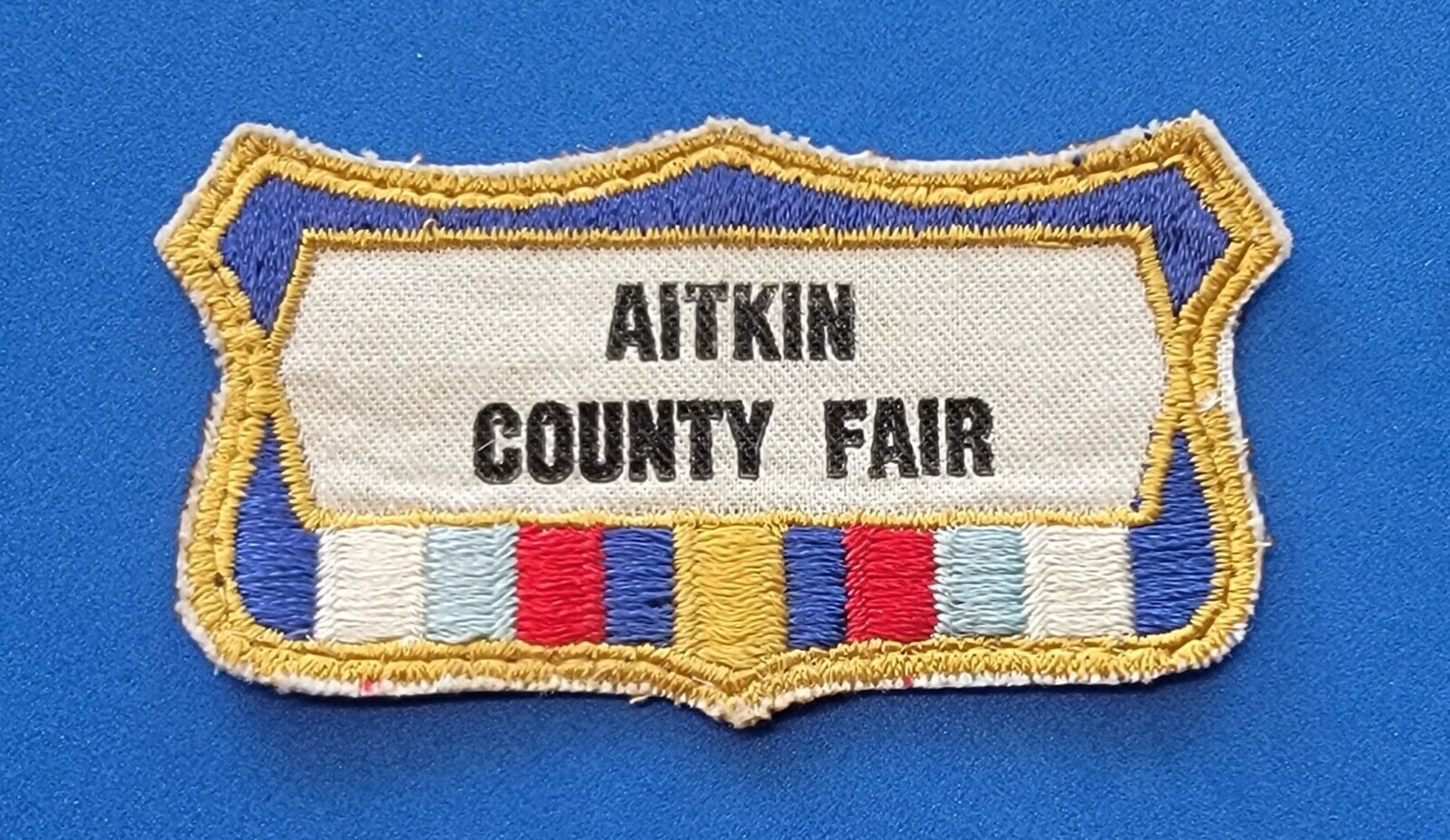 AITKIN COUNTY FAIR MINNESOTA BADGE PATCH VINTAGE NOS 