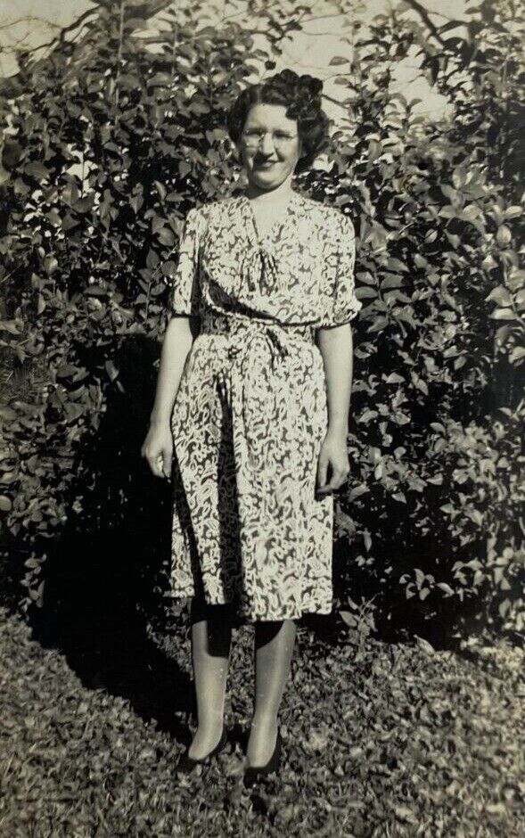 Woman With Glasses In Floral Dress Standing By Bush B&W Photograph 3.25 x 5