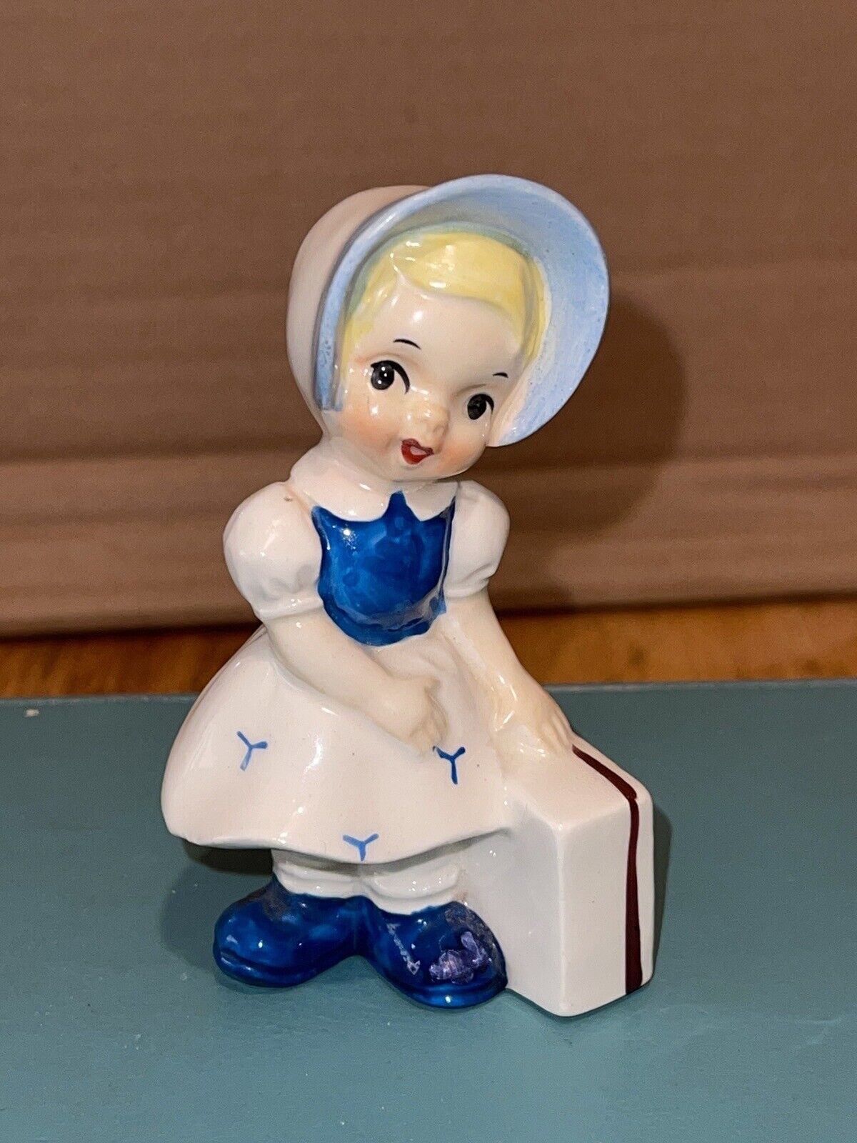 Vintage Ucagco Ceramic Figurine Chore Girl with Luggage
