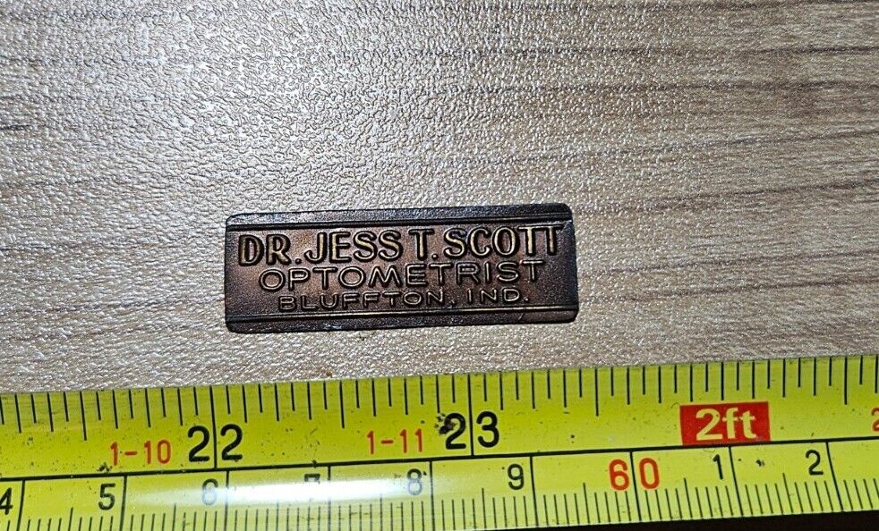 Vintage Dr. Jess T. Scott Optometrist Bluffton Indiana Thin Metal Emblem Label