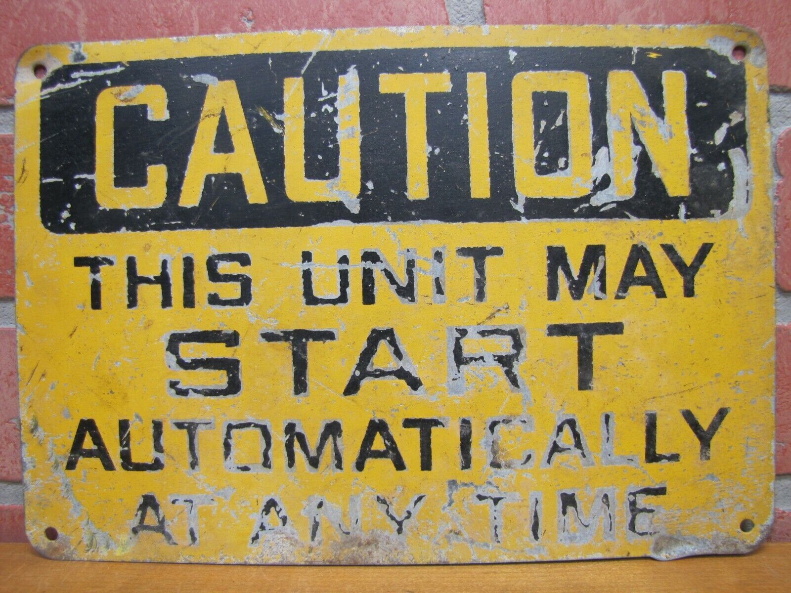 CAUTION THIS UNIT MAY START AUTOMATICALLY Old Industrial Steel Safety Ad Sign