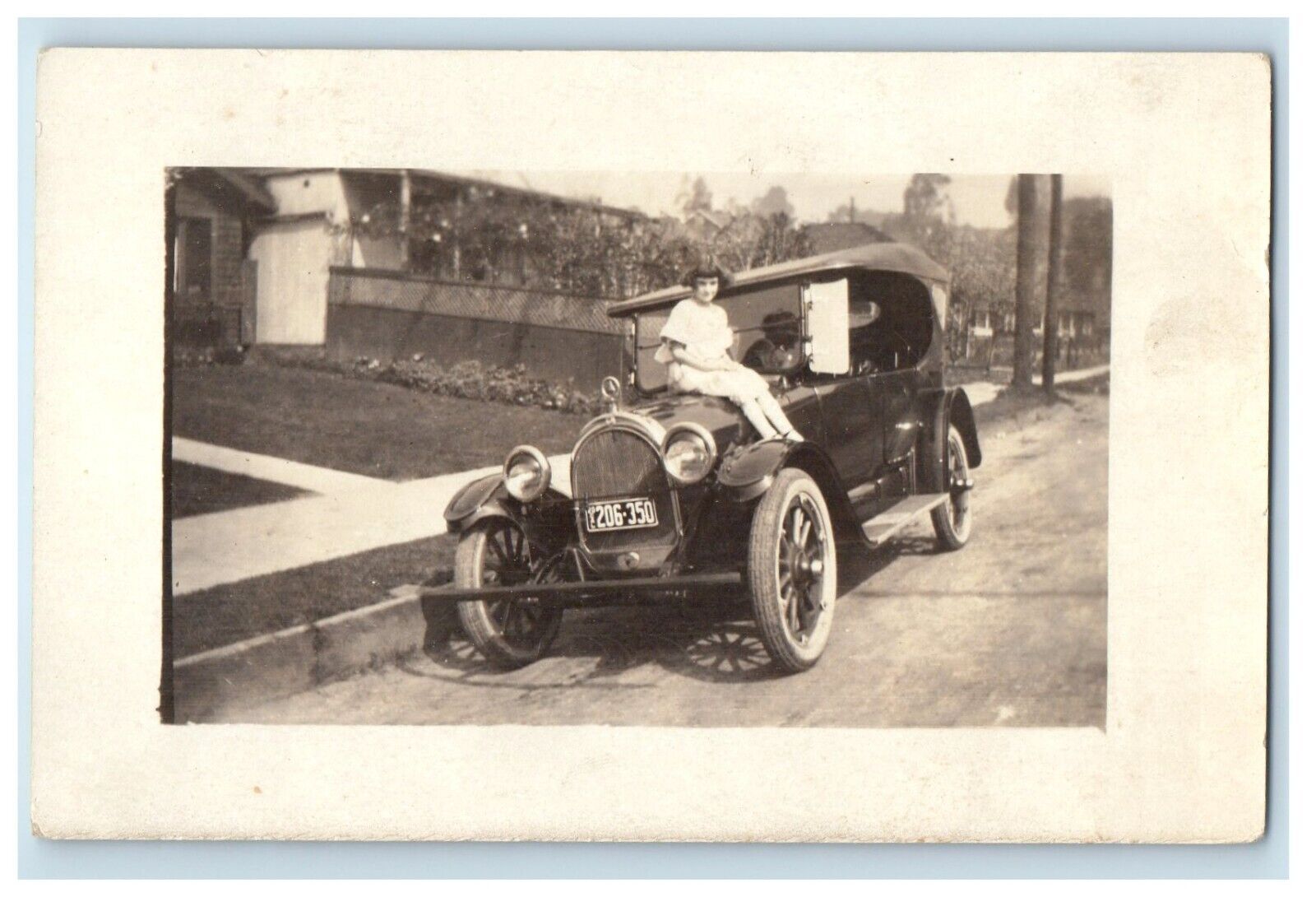 c1910\'s Little Girl Sitting On Car California CA RPPC Photo Antique Postcard