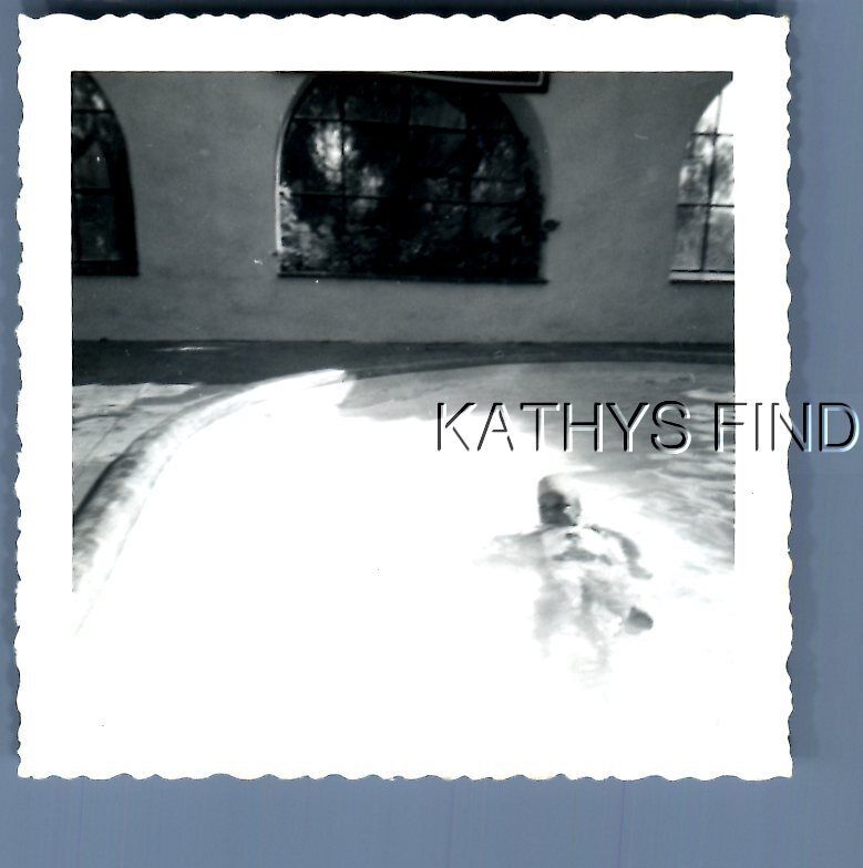 FOUND B&W PHOTO M+5548 VIEW OF PERSON IN SWIMMING POOL