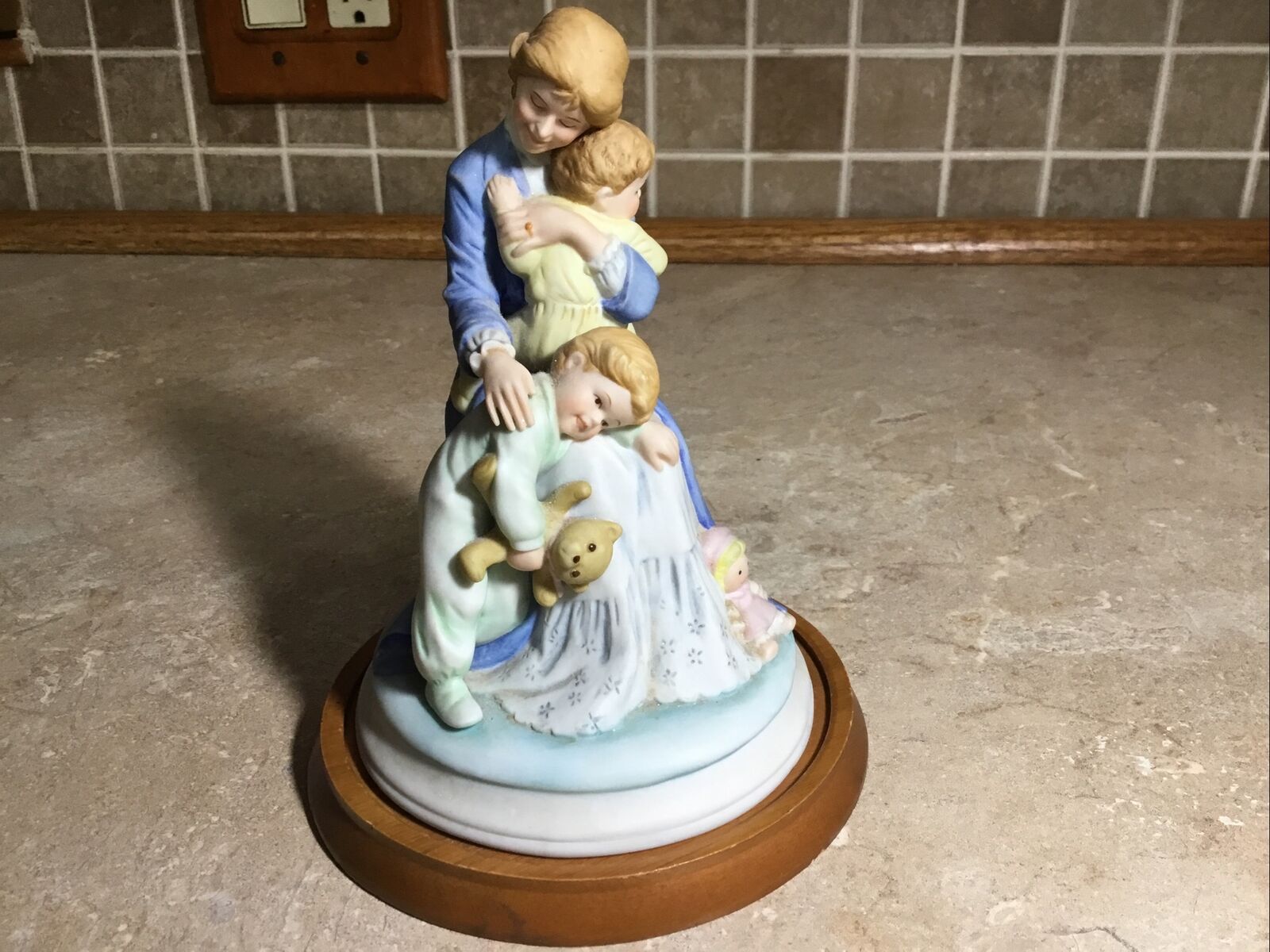 Holly Hobbie -- 1985 IN A MOTHERS ARMS - Wood Base  Figurine- 6” Tall