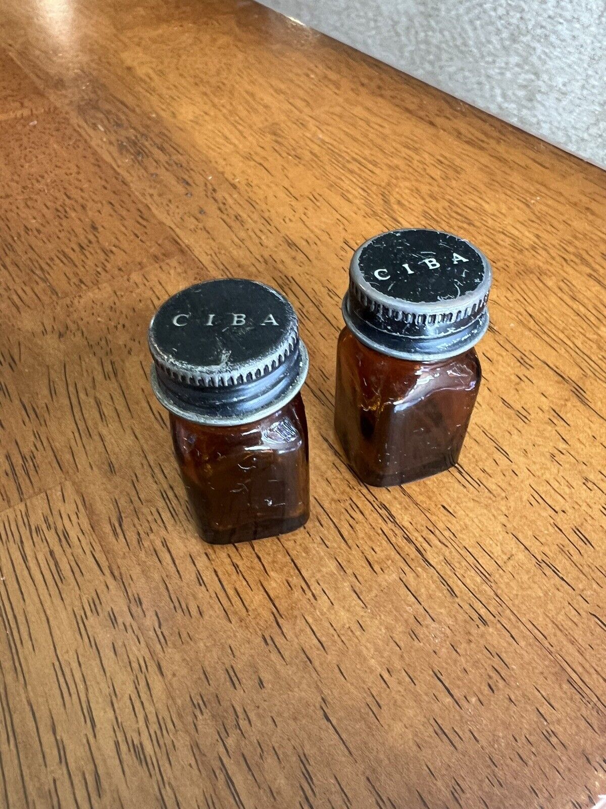 Two Small Vintage Amber Glass Bottle Ciba on Metal Top Medicine Apothocary Decor