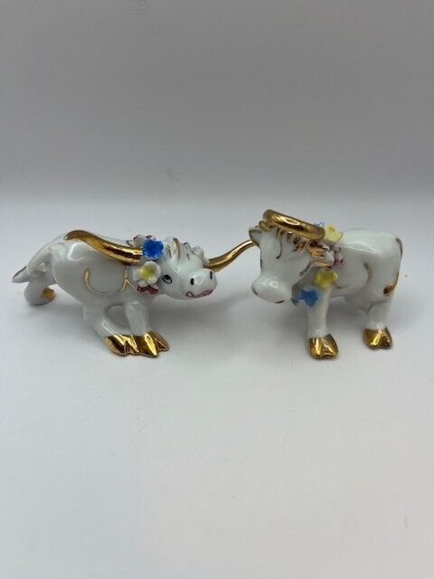 Vintage darling Porcelain Bull figurines, with gold trim