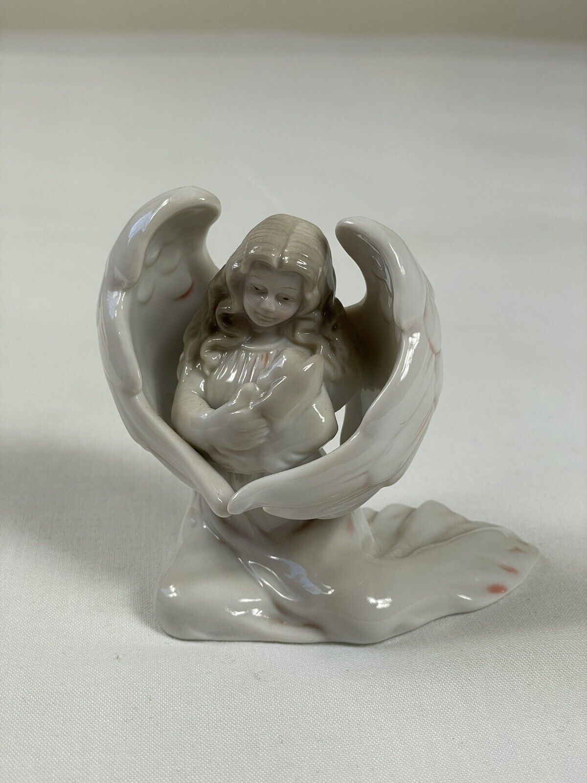 Porcelain Angel Figurine Holding a Baby by Russ Berrie & Co. Item No. 15482