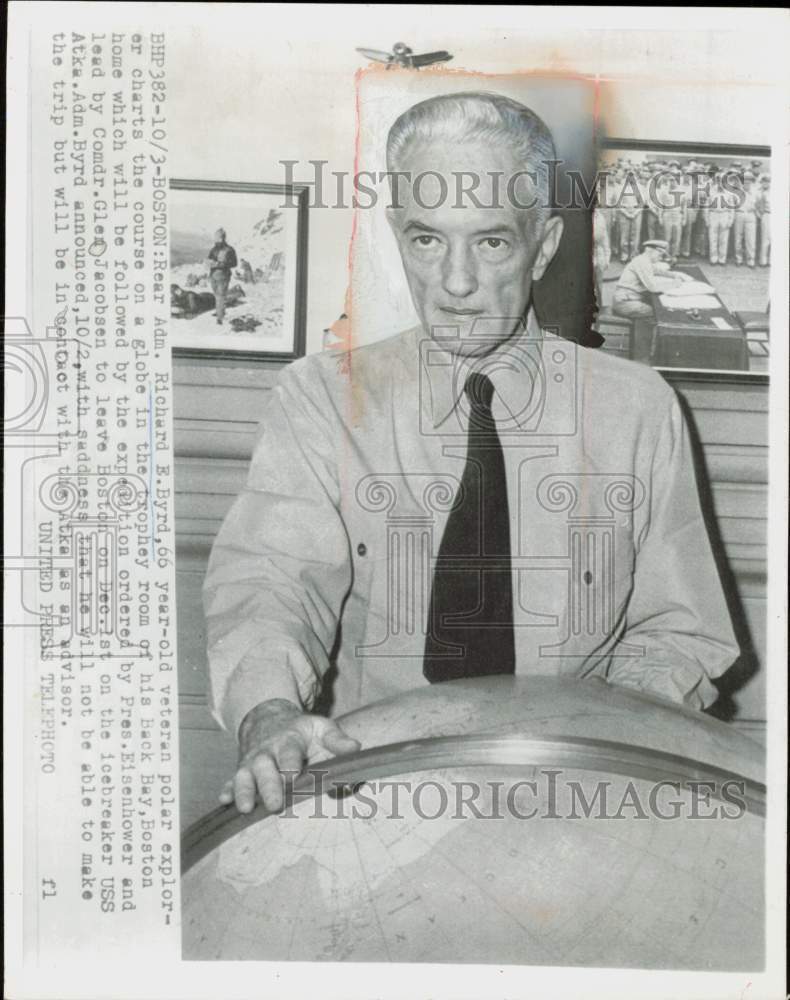 1954 Press Photo Richard B. Byrd charts course of expedition on globe in Boston