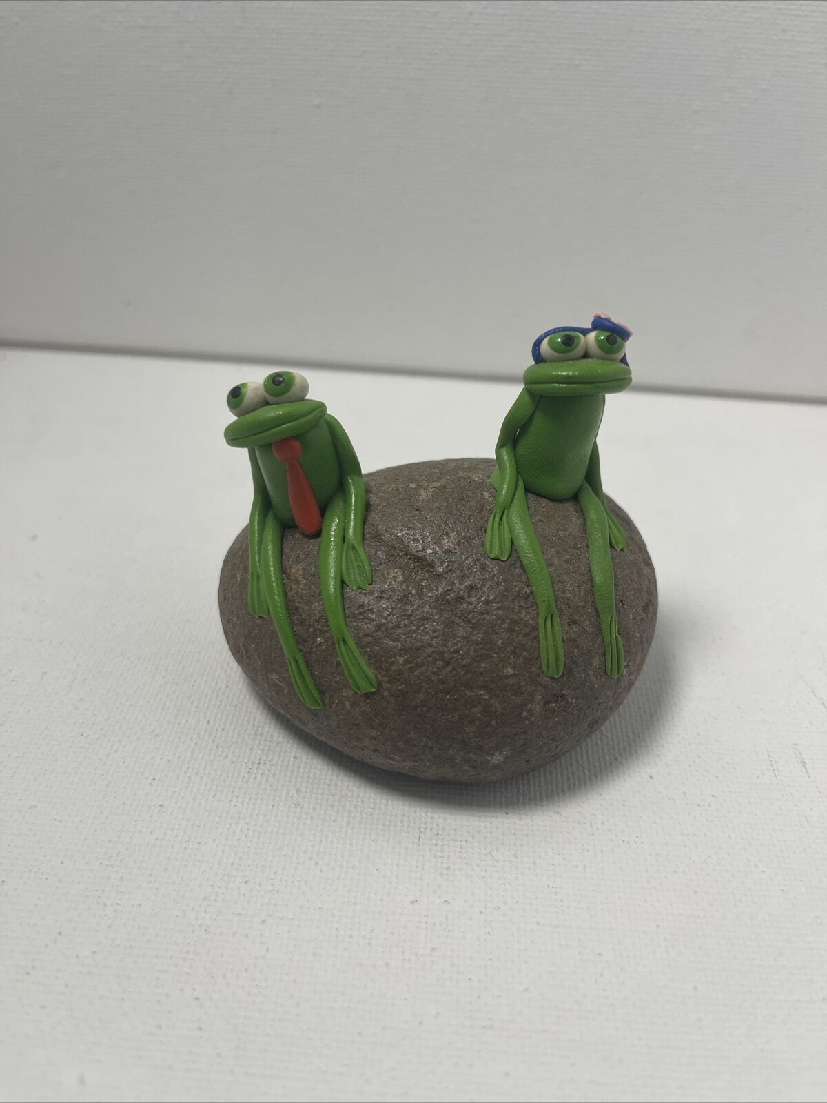 Miniature Clay Handcrafted Sitting Frogs on a Rock.