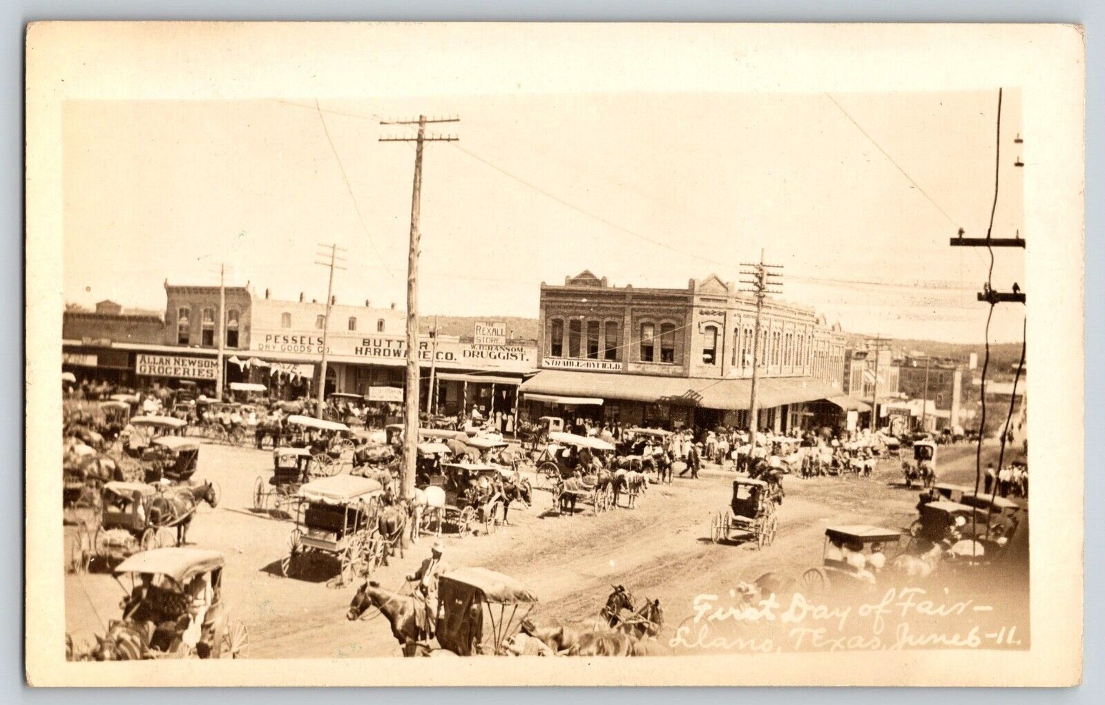 Postcard RPPC First Day of Fair - Llano Texas - 1911 w Drug, Hardware & Grocery