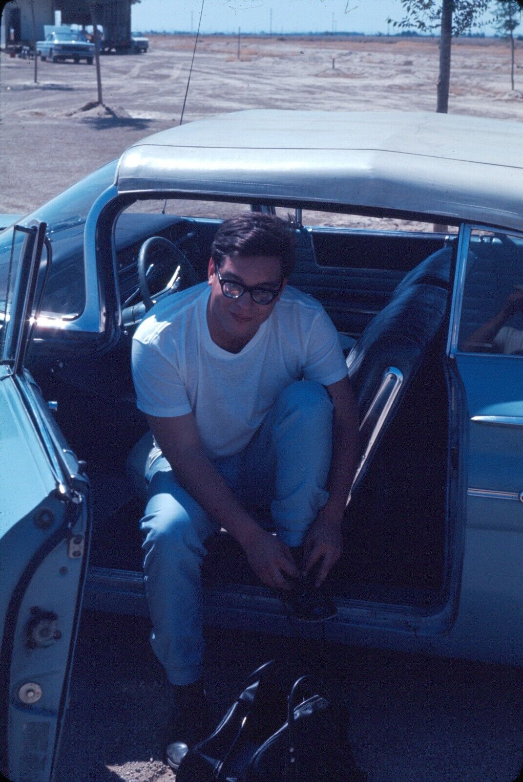 1967 Handsome Young Man Putting on Shoes Sitting in Car Vintage 35mm Slide