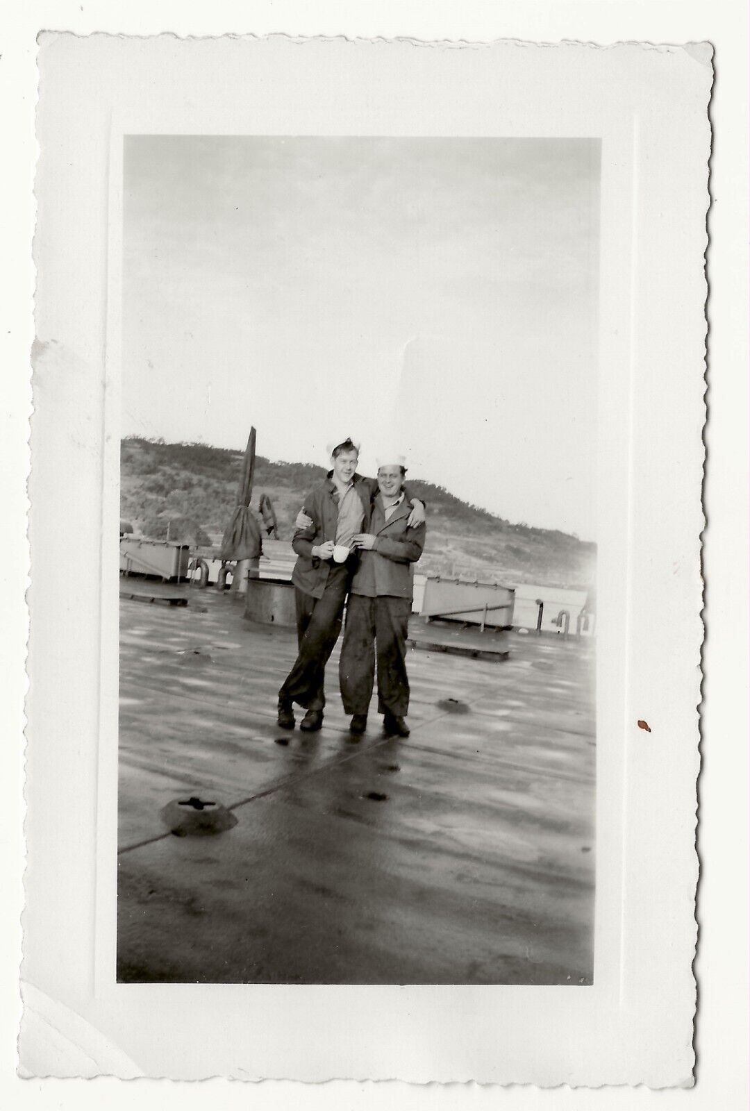 WWII U.S. Navy sailors on ship deck, hugging, snapshot photo, gay interest