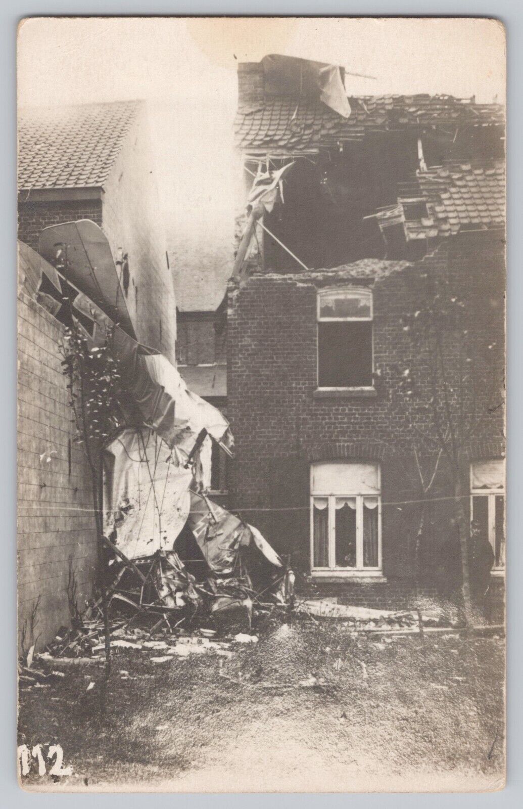 WWI Bi Wing Fighter Plane Aircraft Crashed Into Building Postcard