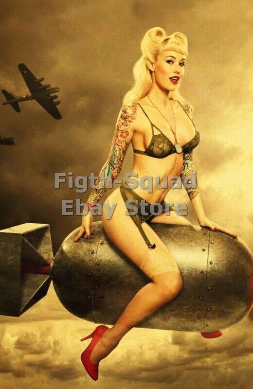 WW2 Picture Photo beautiful woman sitting on air bombs 5905