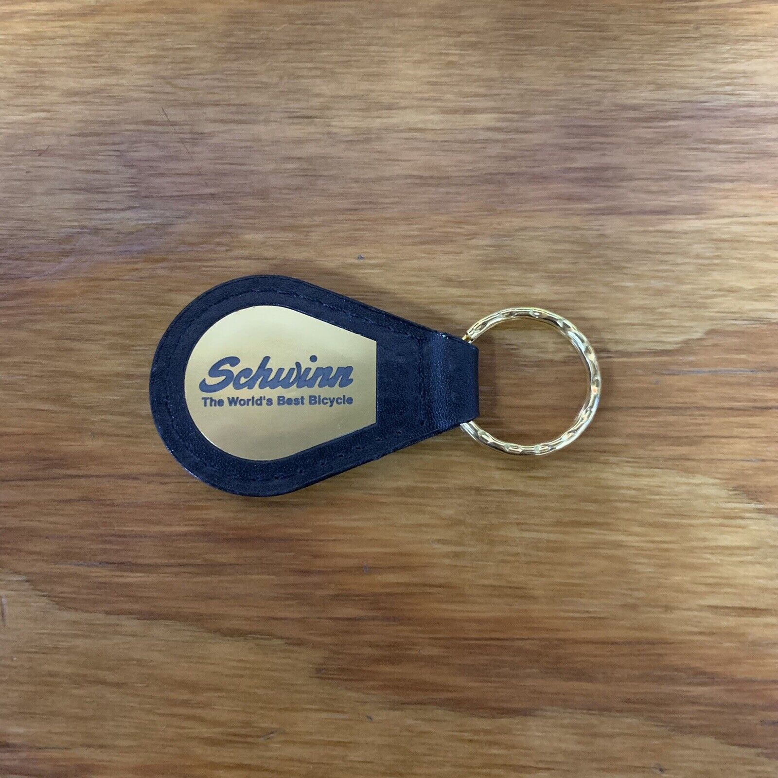 SCHWINN BICYCLE KEY CHAIN GOLD BLACK LEATHER THE WORLD\'S BEST BICYCLE NOS