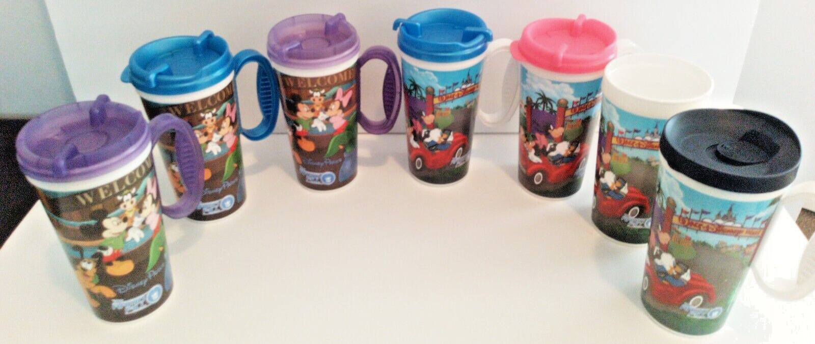 Lot of 7 Walt Disney Parks Rapid Fill Hot Cold Refillable Souvenir Mug Cups