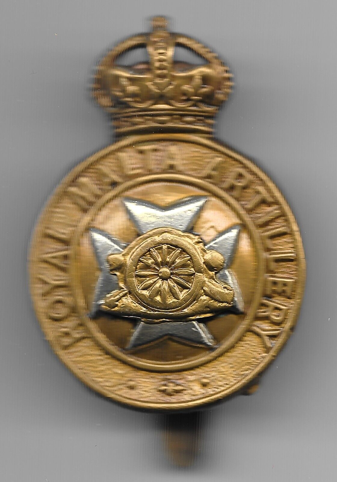 Original Royal Malta Artillery Bi-metal Cap Badge from the period 1904-1938