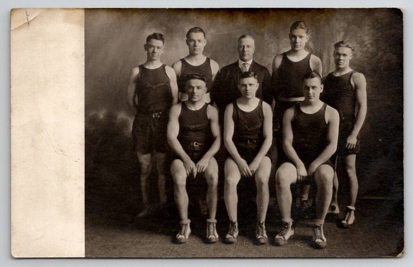 RPPC Athletic Team 7 Muscular Players and Coach Flight Wings Logo Postcard I23
