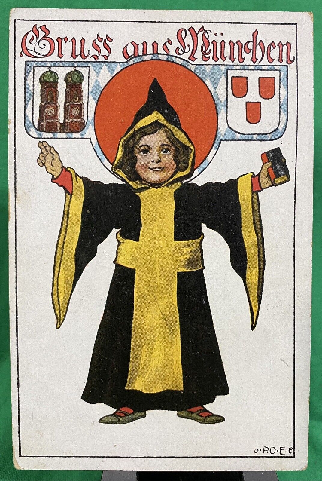 1900s German Postcard Gruss aus Munchen Boy Wizard Black Yellow Robe Munich