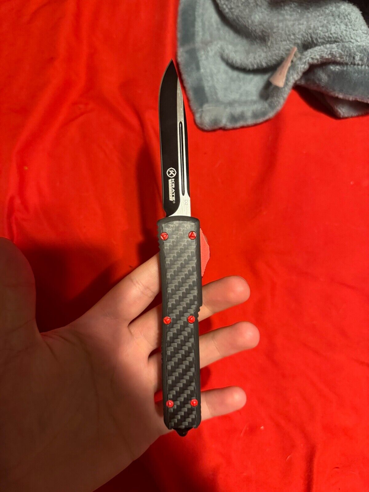 Krate Tactical Carbon Fiber Knife. Black with a little red