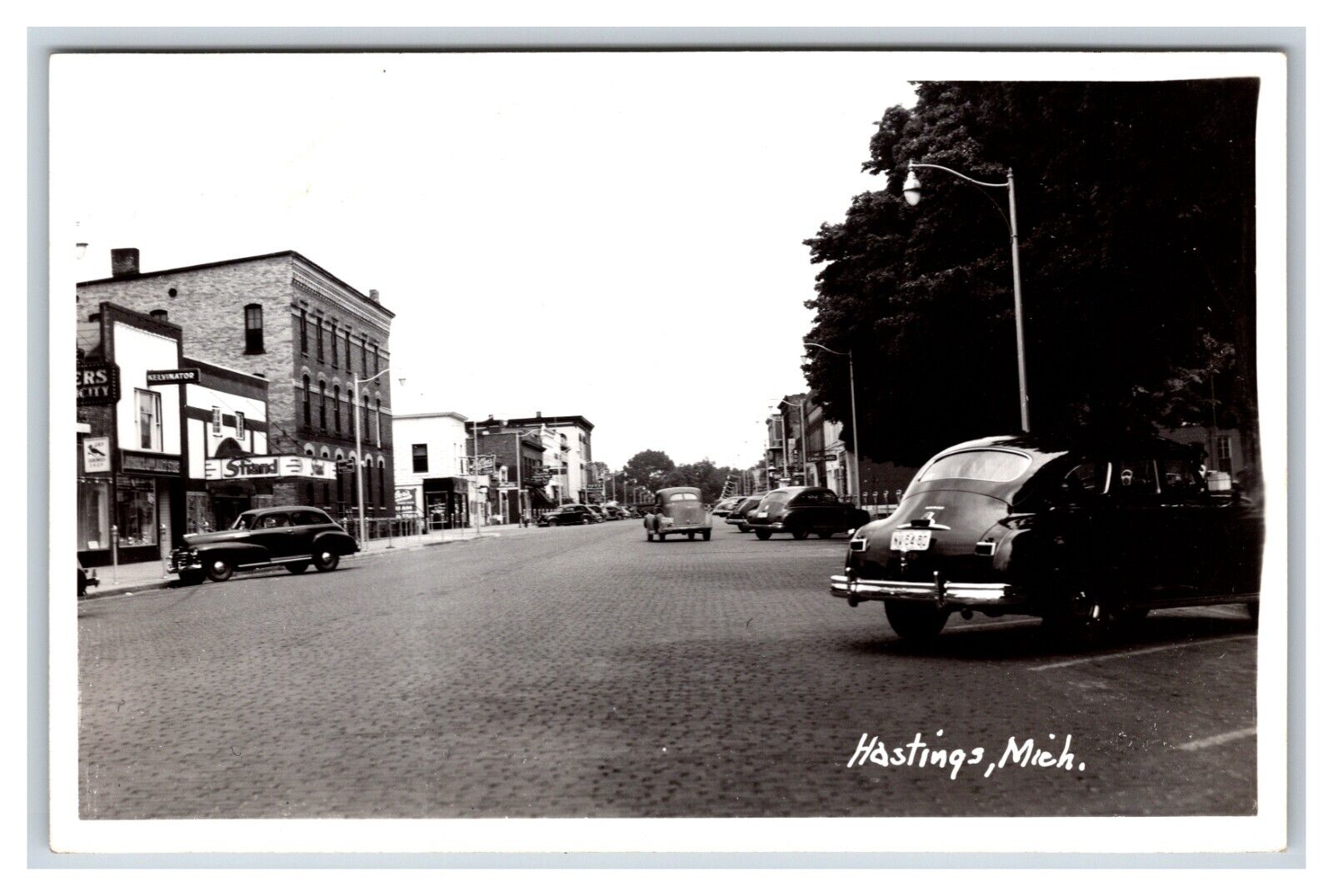 RPPC Street View Cars Strand Theater Hastings Michigan MI 1940s UNP Postcard R8