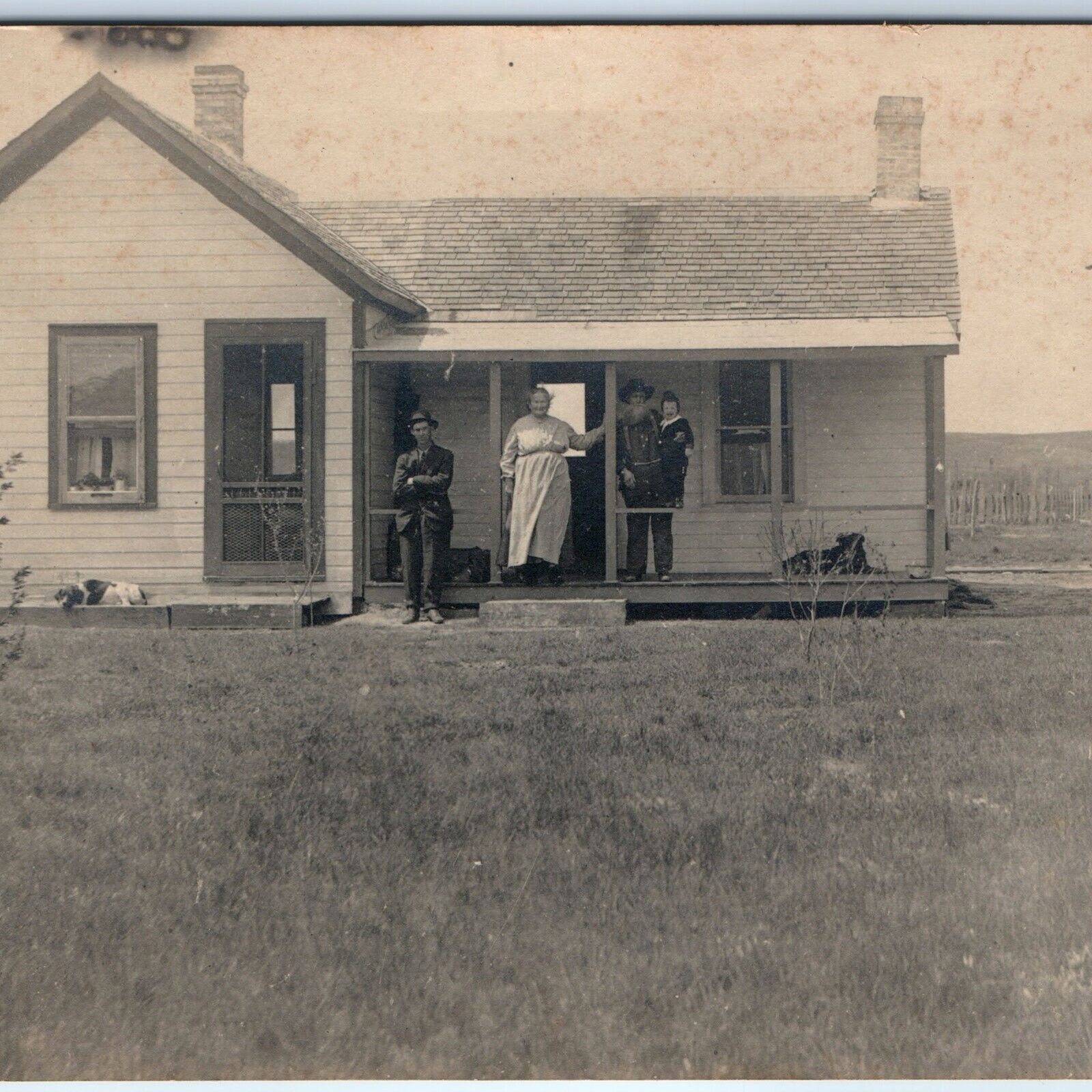 c1910s Folk Victorian Small Farmhouse RPPC Dogs Family Porch Photo House A173