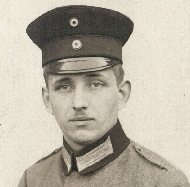 WWI German Soldier In Uniform Cap Cockade Portrait Real Photo Postcard 