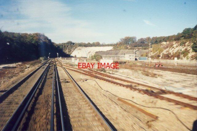 PHOTO  1999 MICHELDEVER OIL TERMINAL (DISUSED) SEEN FROM THE REAR OF A TRAIN TRA