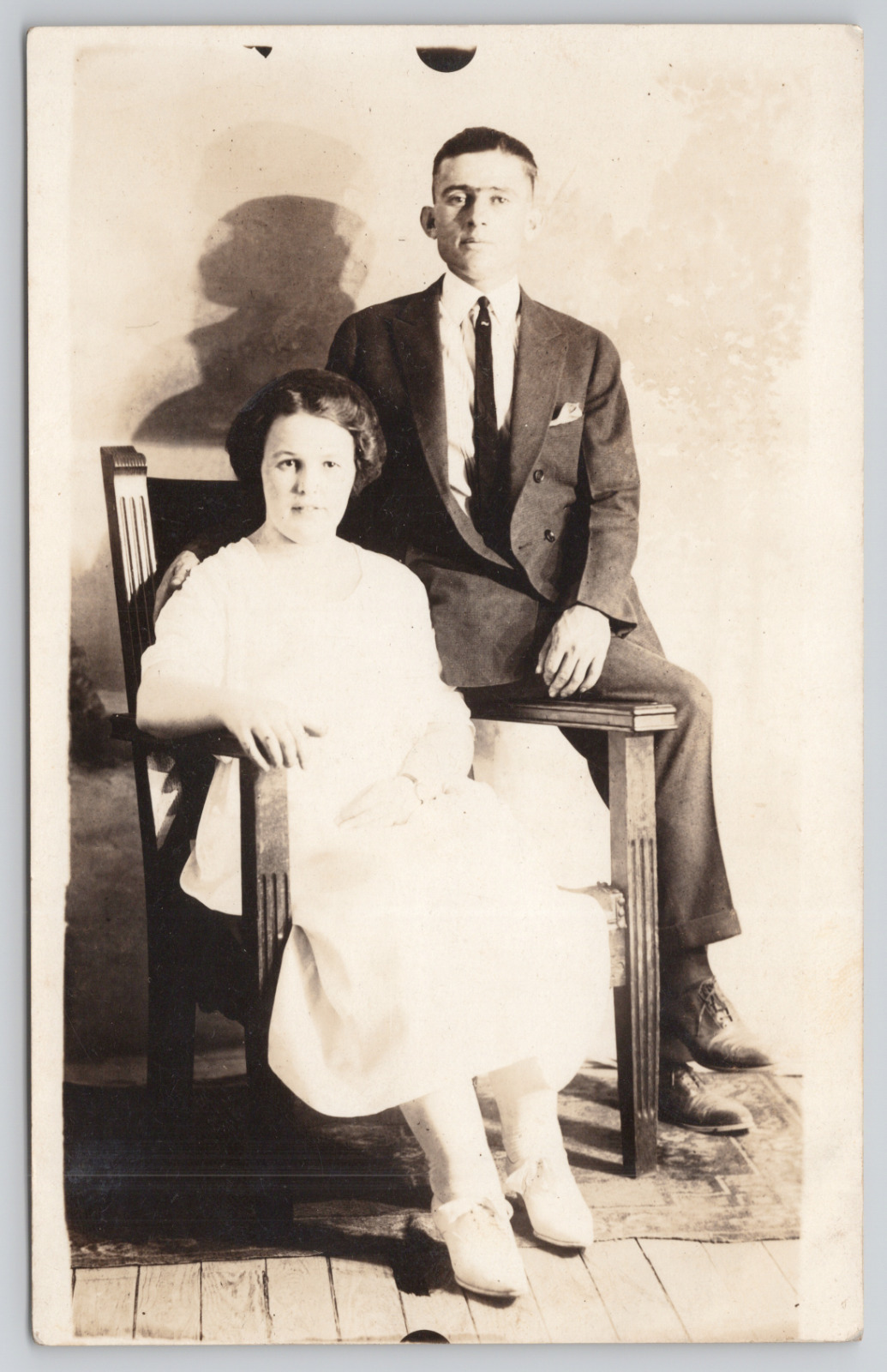 RPPC Young Couple Sitting in Studio Chair c1910 Real Photo Postcard