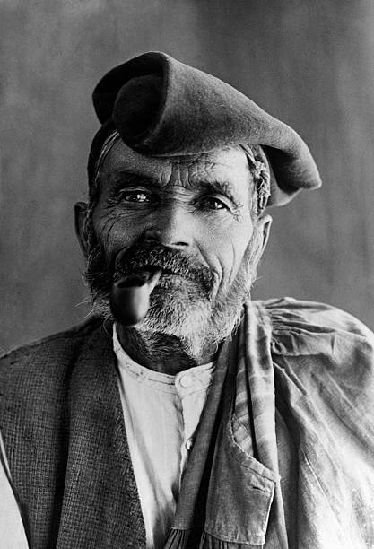 Portrait an old Catalan peasant wearing a bag-shaped hat a tra- 1931 Old Photo